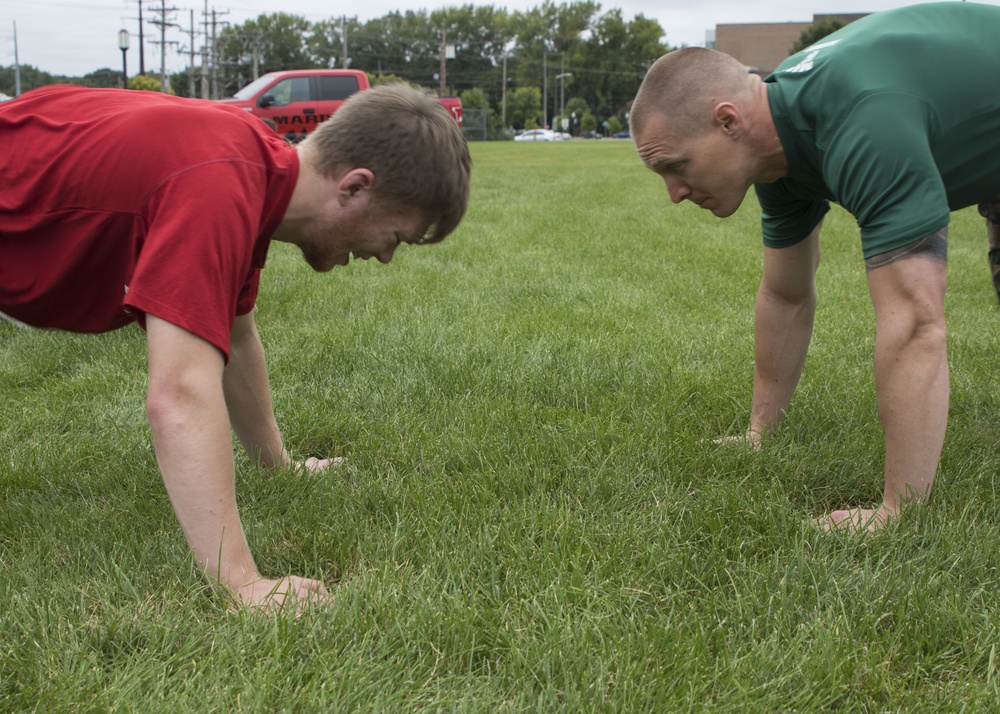 Digging deep; Marines train St. Cloud Wrestling Team to strive for greatness