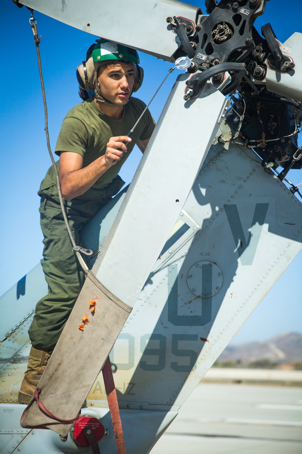 Marines with HMLA 267 maintain AH-1Z Viper Attack Helicopters