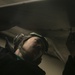 Aviation Structural Mechanic Fastens Screws of an MH-60S Seahawk Helicopter