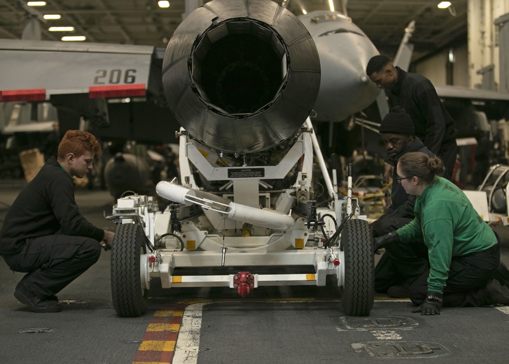 Sailors Transport the Engine of a F/A-18E Super Hornet