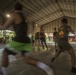 Service members and Barangay Pablicion Uno play basketball during KAMANDAG 2