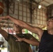 Service members and Barangay Pablicion Uno play basketball during KAMANDAG 2