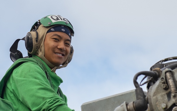 USS Bonhomme Richard (LHD 6) HSC 23 Counterparts perform maintenance on MH-60S
