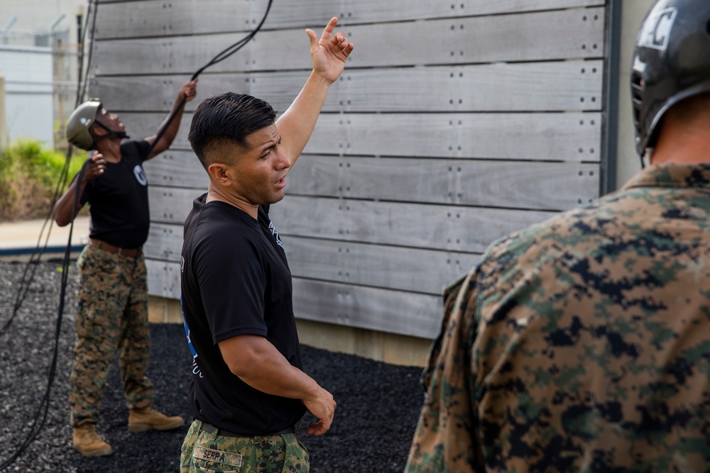 Helicopter rope suspension techniques training held at Camp Schwab rappel tower