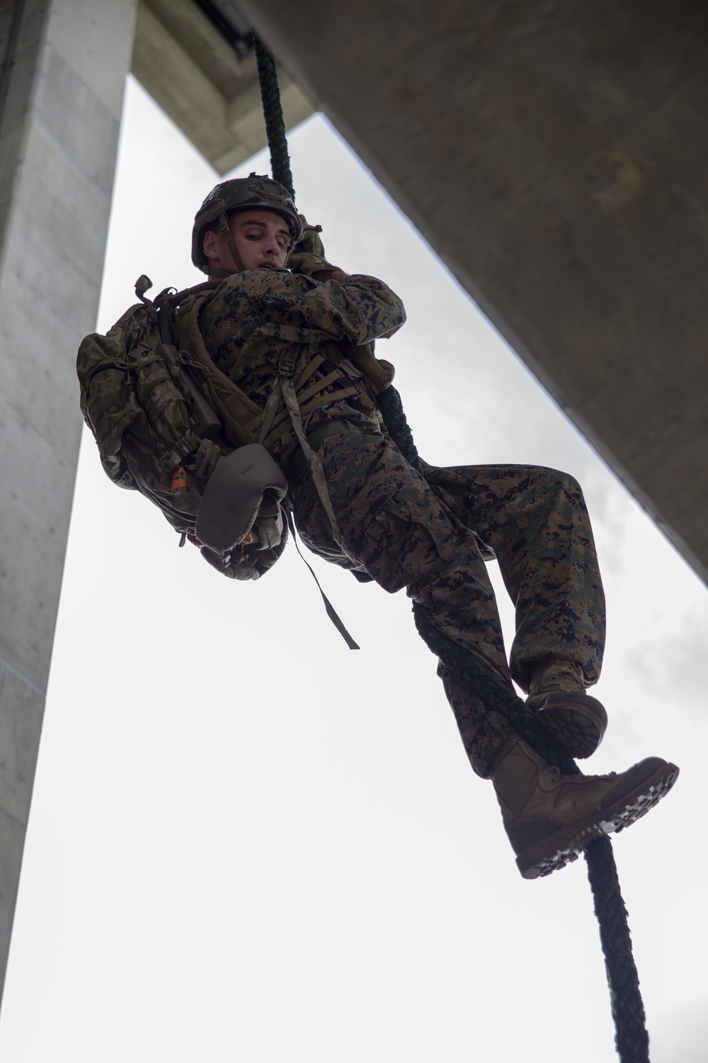 Helicopter rope suspension techniques training held at Camp Schwab rappel tower