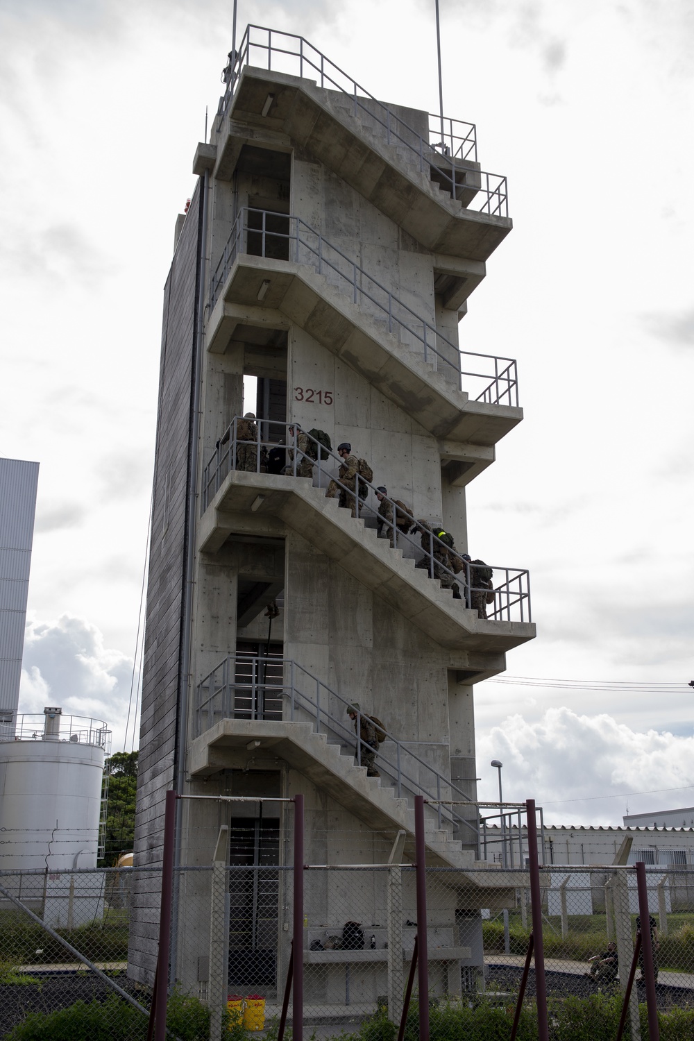 Helicopter rope suspension techniques training held at Camp Schwab rappel tower