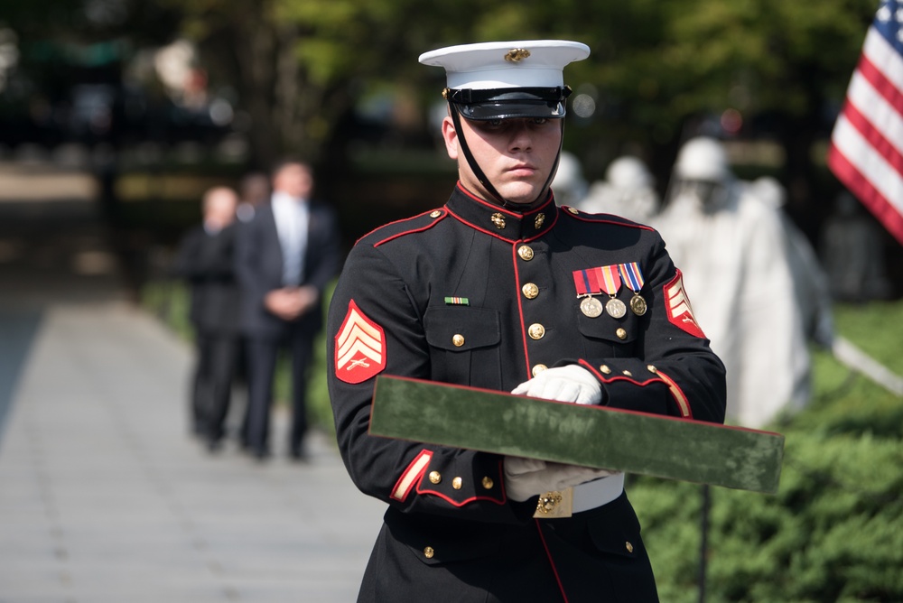 The Vice President, Secretary of the Interior and Deputy Secretary of Defense participate in a flag presentation ceremony