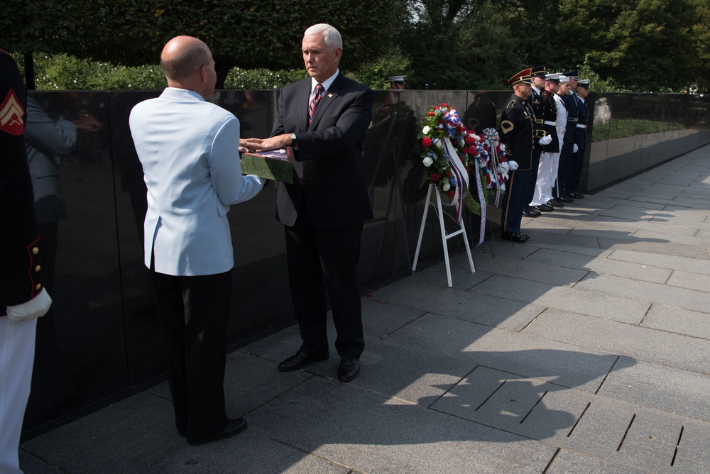 The Vice President, Secretary of the Interior and Deputy Secretary of Defense participate in a flag presentation ceremony