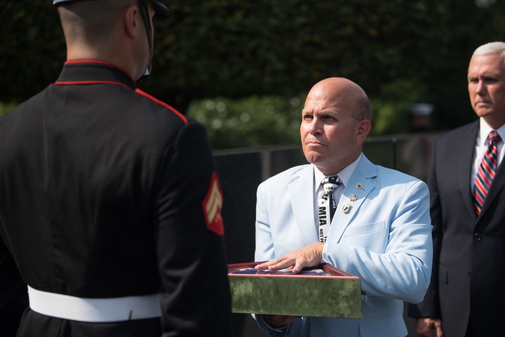 The Vice President, Secretary of the Interior and Deputy Secretary of Defense participate in a flag presentation ceremony