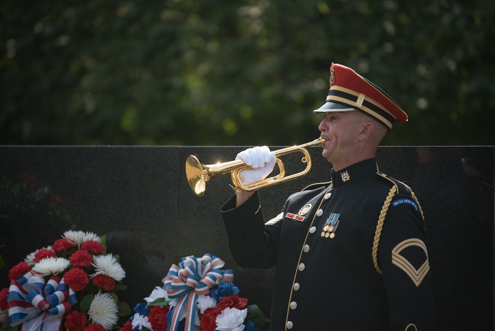 The Vice President, Secretary of the Interior and Deputy Secretary of Defense participate in a flag presentation ceremony