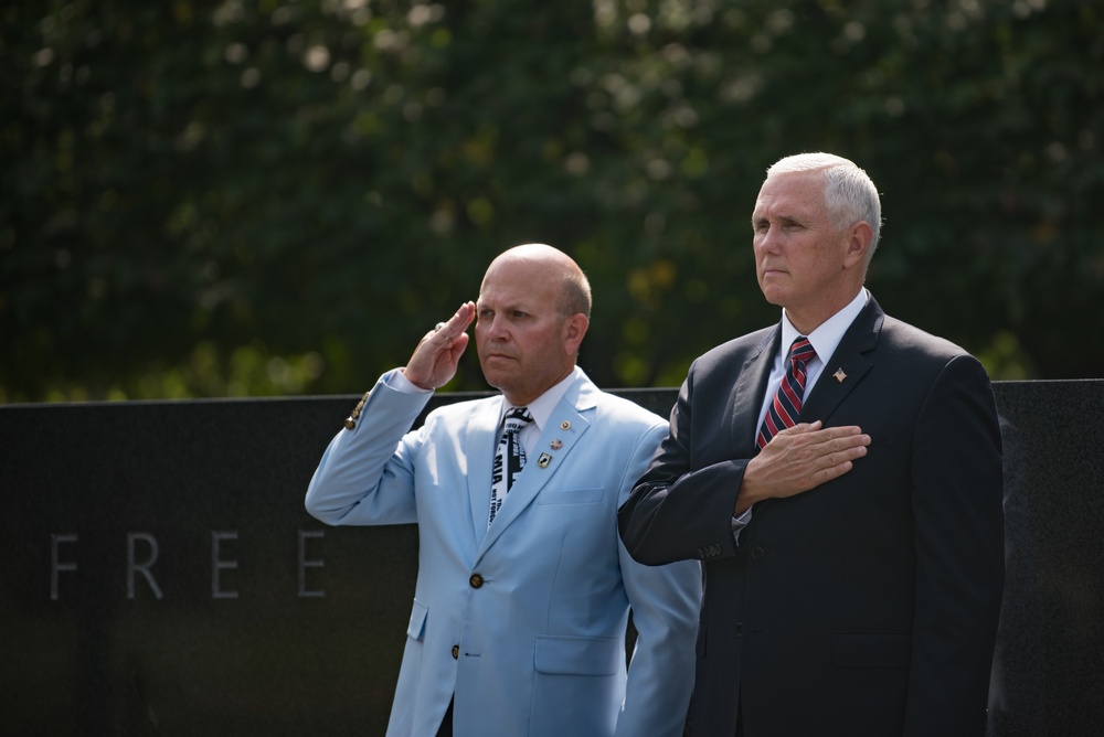 The Vice President, Secretary of the Interior and Deputy Secretary of Defense participate in a flag presentation ceremony