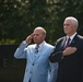 The Vice President, Secretary of the Interior and Deputy Secretary of Defense participate in a flag presentation ceremony