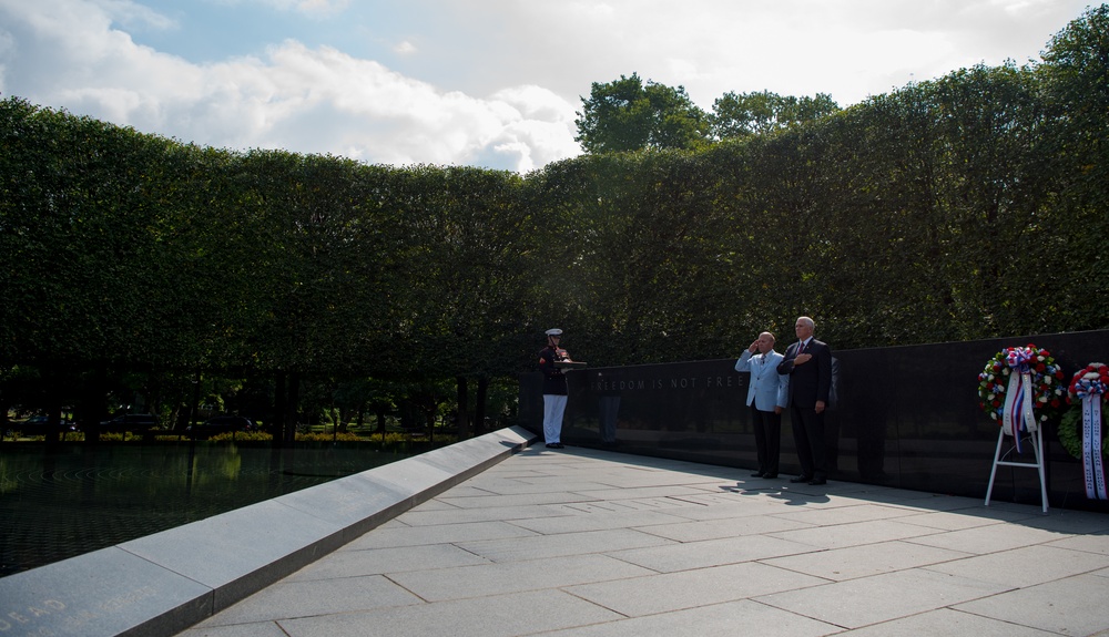 The Vice President, Secretary of the Interior and Deputy Secretary of Defense participate in a flag presentation ceremony