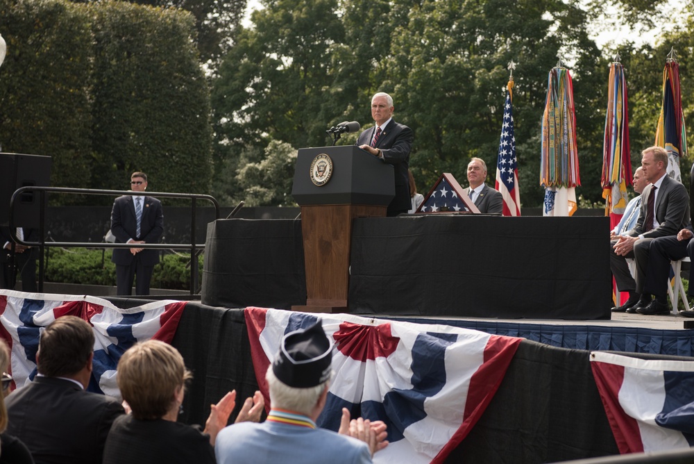 The Vice President, Secretary of the Interior and Deputy Secretary of Defense participate in a flag presentation ceremony