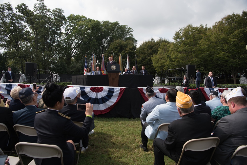 The Vice President, Secretary of the Interior and Deputy Secretary of Defense participate in a flag presentation ceremony