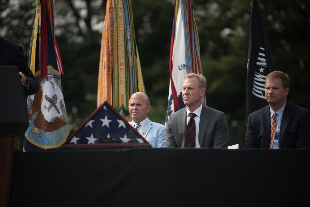 The Vice President, Secretary of the Interior and Deputy Secretary of Defense participate in a flag presentation ceremony