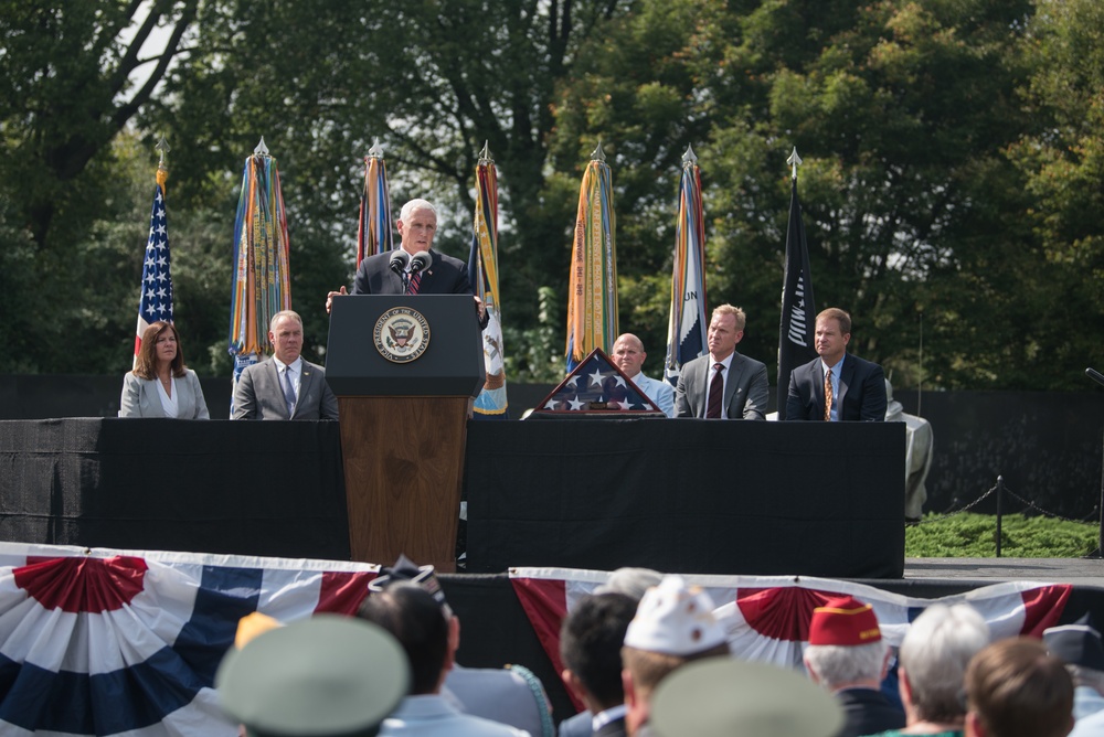 The Vice President, Secretary of the Interior and Deputy Secretary of Defense participate in a flag presentation ceremony