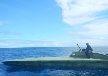 U.S. Coast Guard Cutter Seneca crewmembers inspect a suspected drug smuggling vessel