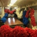 Volunteers fabricate a giant lei to hang on the USS Wisconsin