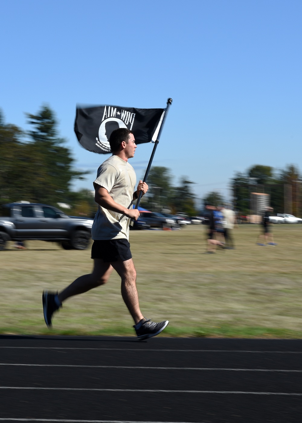 Airman carries POW MIA flag