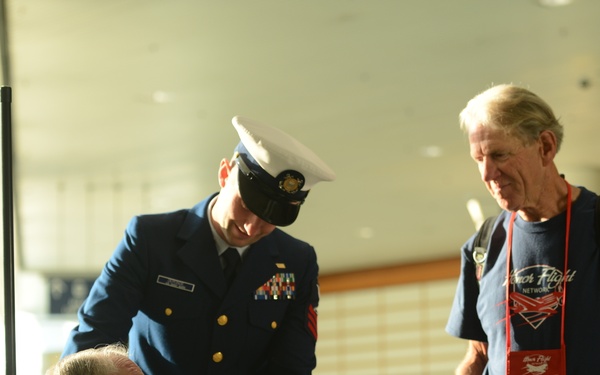 Coast Guard members visit with war veterans at PDX