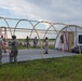 Airmen build a shelter during Combat Support Wing Exercise