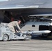 Airmen simulate arming an F-22 Raptor