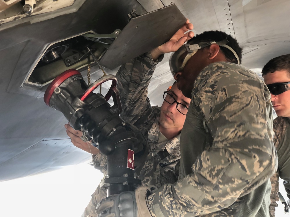 Airmen provide fuel to F-22 Raptor during exercise