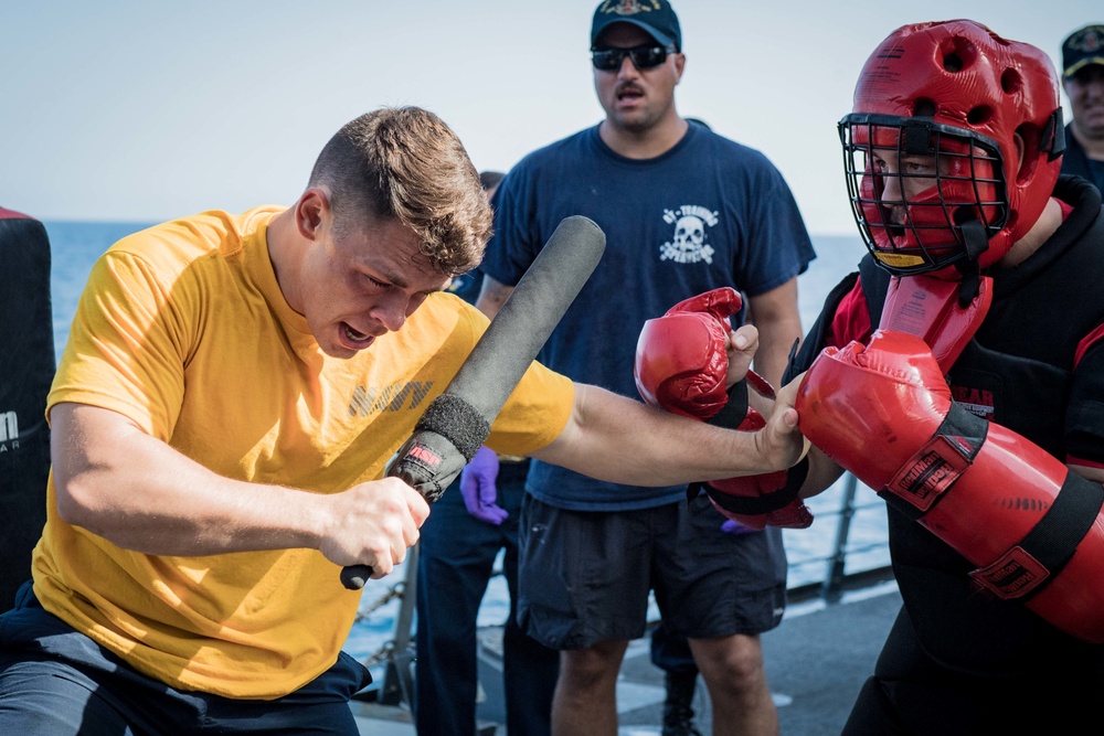 Sailors battle the O.C. Spray course for security reaction force basic training on USS Jason Dunham (DDG 109)