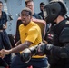 Sailors battle the O.C. Spray course for security reaction force basic training on USS Jason Dunham (DDG 109)