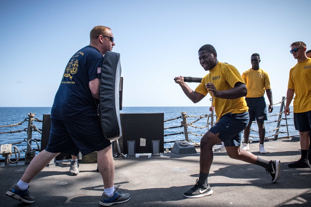 Sailors battle the O.C. Spray course for security reaction force basic training on USS Jason Dunham (DDG 109)