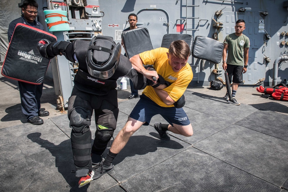 Sailors battle the O.C. Spray course for security reaction force basic training on USS Jason Dunham (DDG 109)