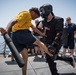 Sailors battle the O.C. Spray course for security reaction force basic training on USS Jason Dunham (DDG 109)