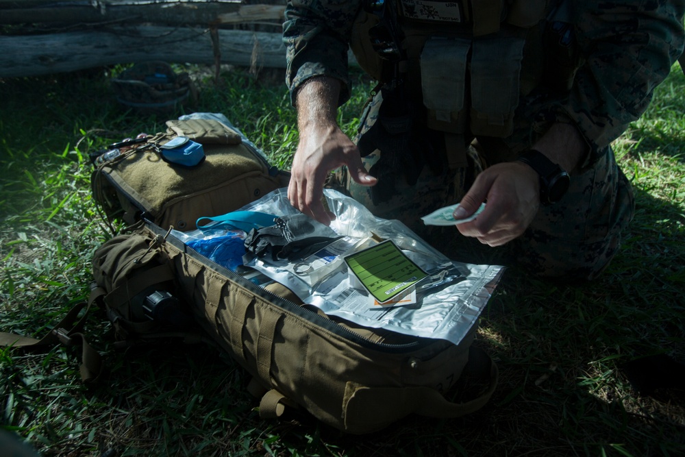 Corpsmen with Battalion Landing Team, 2nd Battalion, 5th Marines, simulate fresh whole blood auto-transfusion