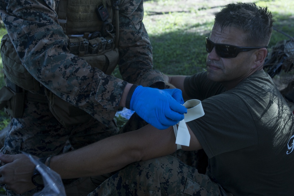 Corpsmen with Battalion Landing Team, 2nd Battalion, 5th Marines, simulate fresh whole blood auto-transfusion