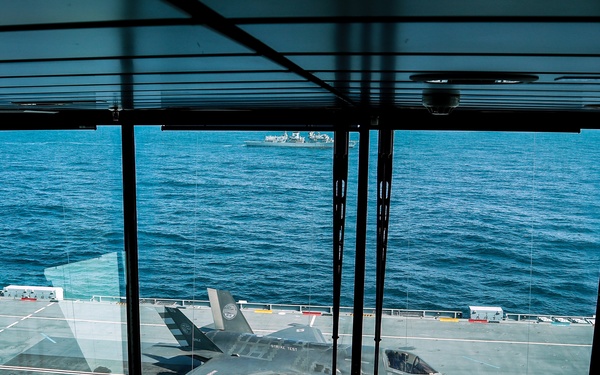 Fighter jets join forces with British aircraft carrier to make history
