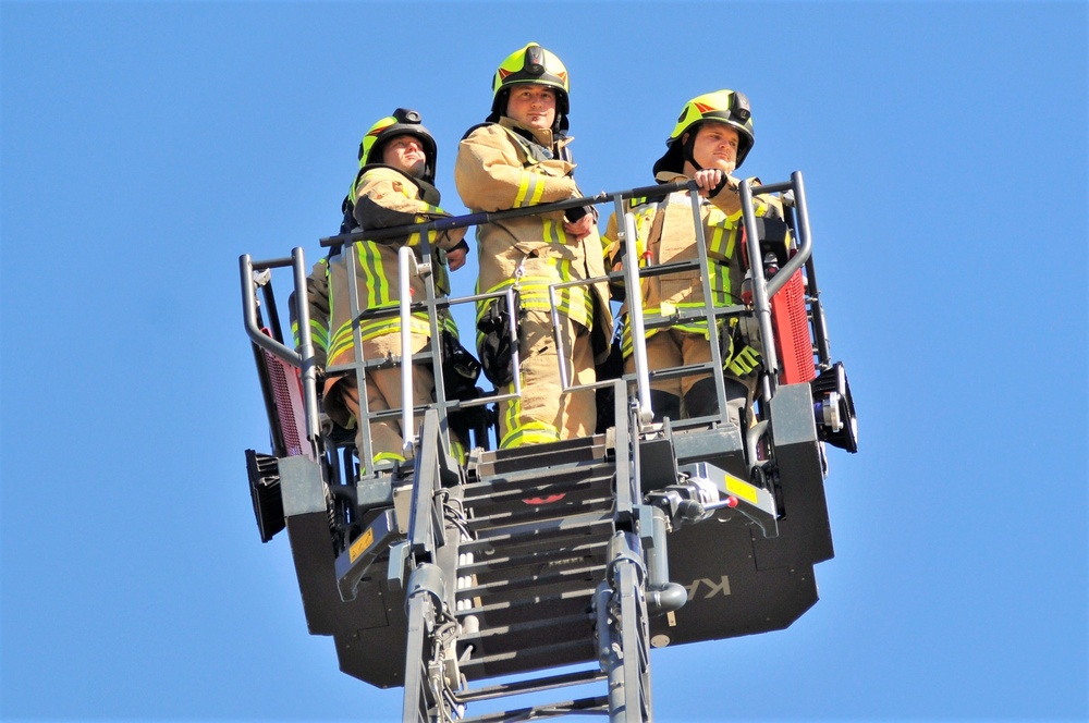 Firefighters demonstrate evacuation and rescue procedures