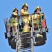 Firefighters demonstrate evacuation and rescue procedures