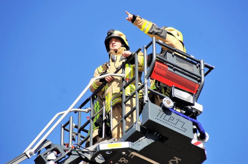 Firefighters demonstrate evacuation and rescue procedures