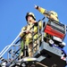 Firefighters demonstrate evacuation and rescue procedures