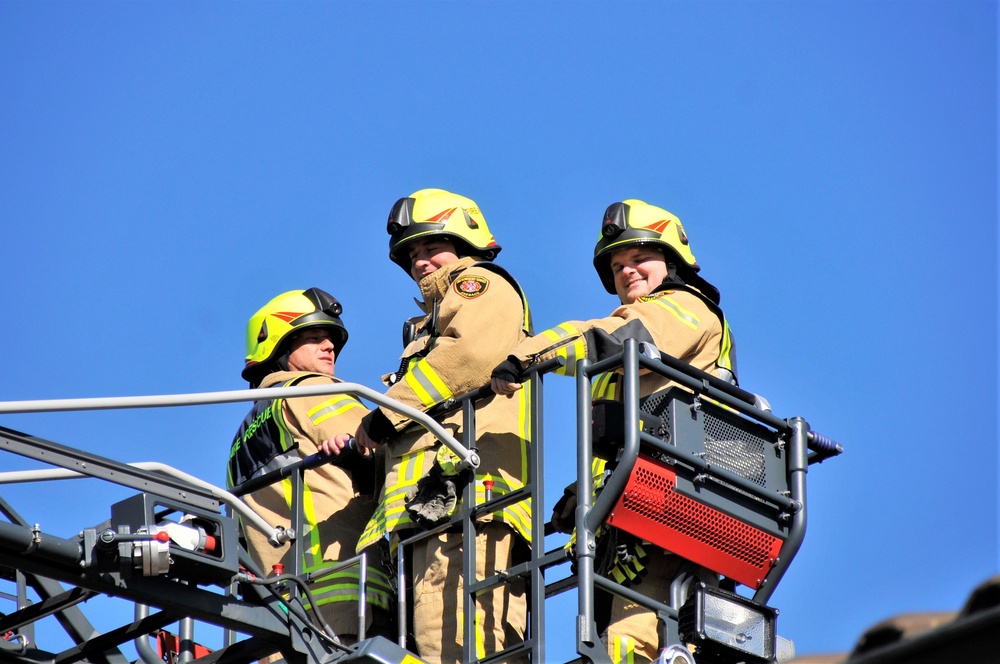 Firefighters demonstrate evacuation and rescue procedures