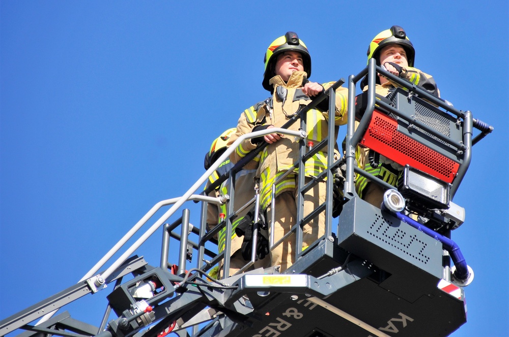 Firefighters demonstrate evacuation and rescue procedures