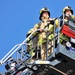 Firefighters demonstrate evacuation and rescue procedures