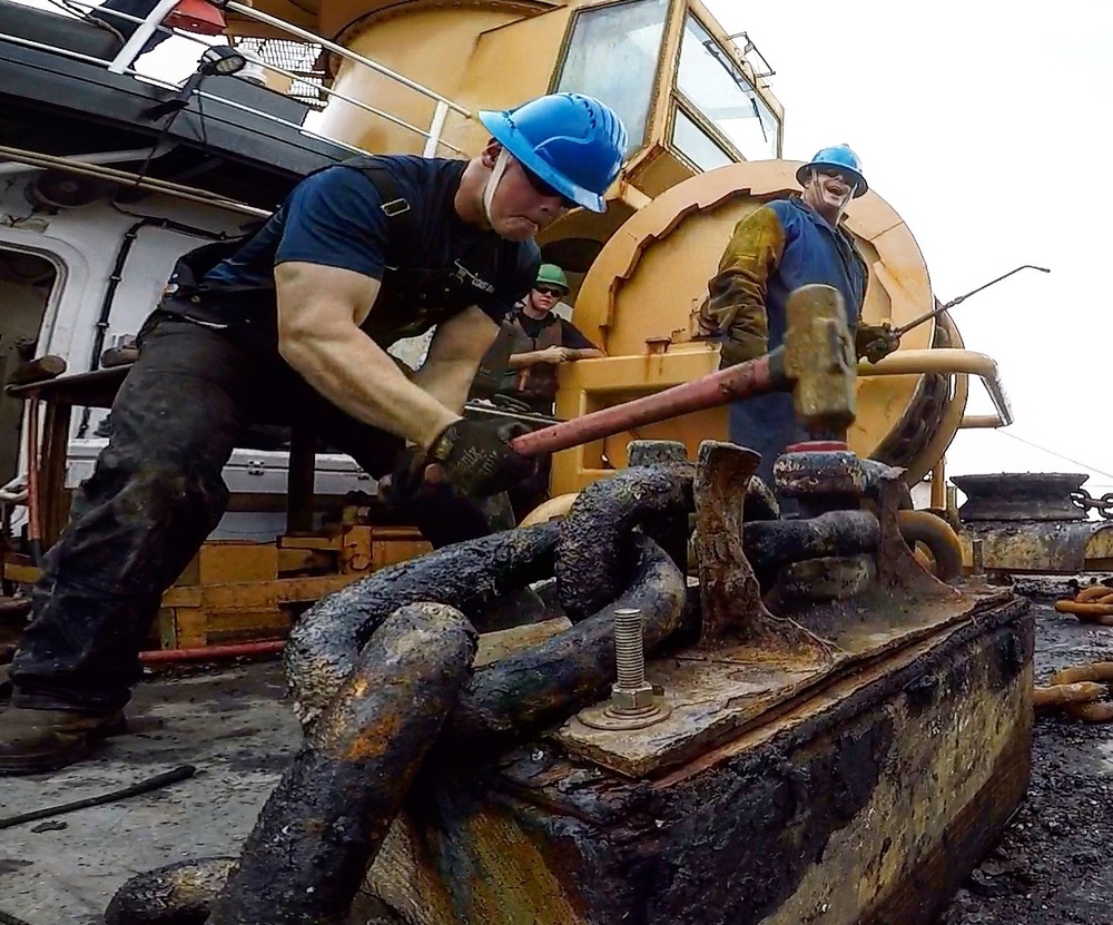 Coast Guard Cutter Cypress crew members conduct buoy deck operations