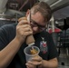 Sailor Prepares Coffee Aboard GHWB