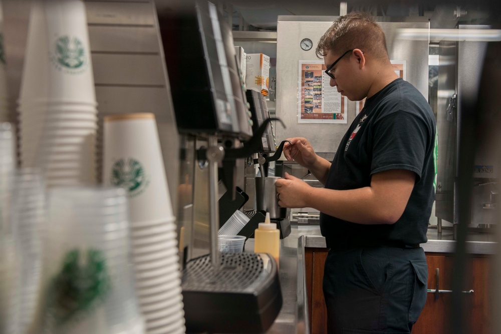 Sailor Prepares Cappuccino Aboard GHWB