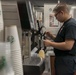 Sailor Prepares Cappuccino Aboard GHWB