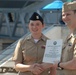 STG2(SW) Wells re-enlistment aboard the USS Wisconsin (BB-64)