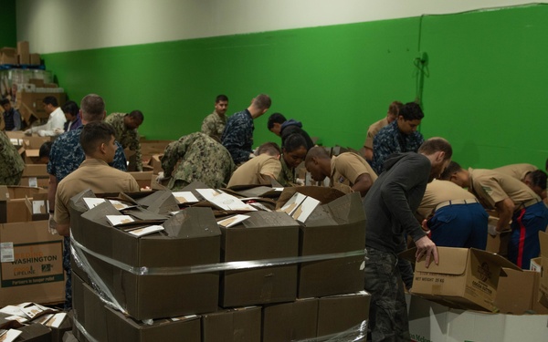 Marines and Sailors volunteer at the San Francisco Food Bank