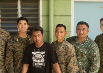 U.S. Marines and Sailors aid in local accident